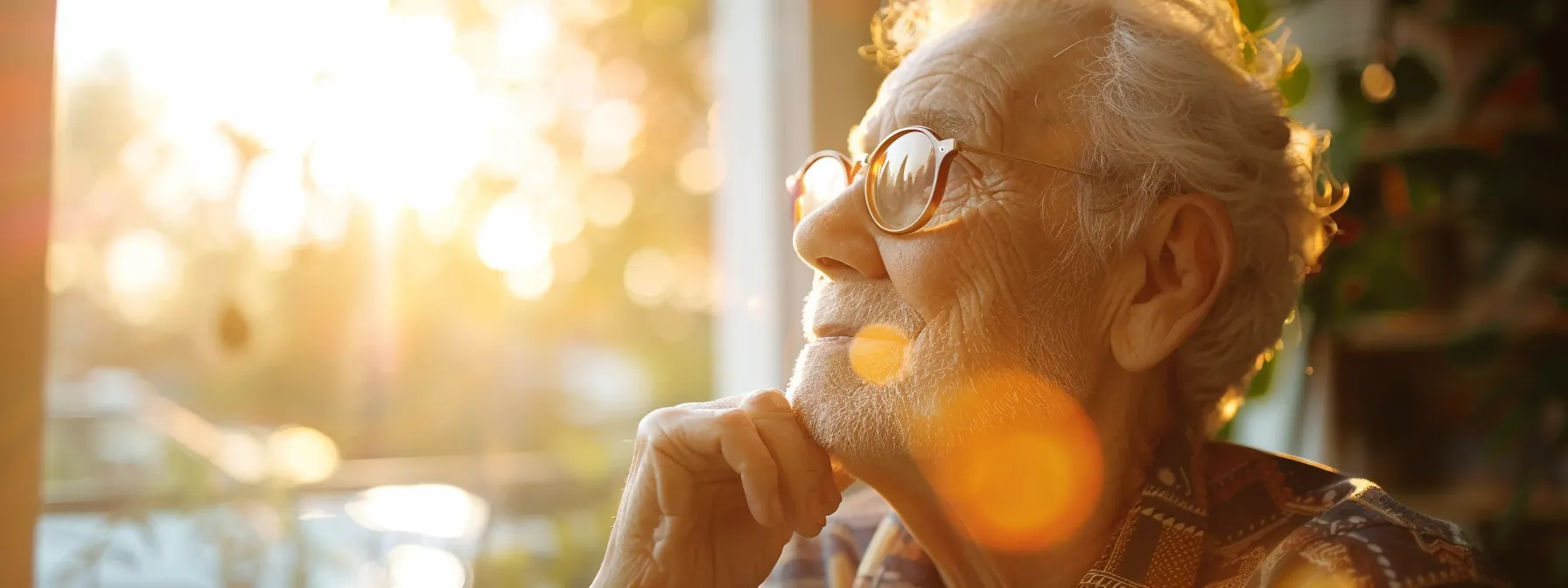 a wise, elderly person thoughtfully examining a pair of glasses in a sunlit room, symbolizing the importance of age-focused eye care and the evolution of vision needs over time.